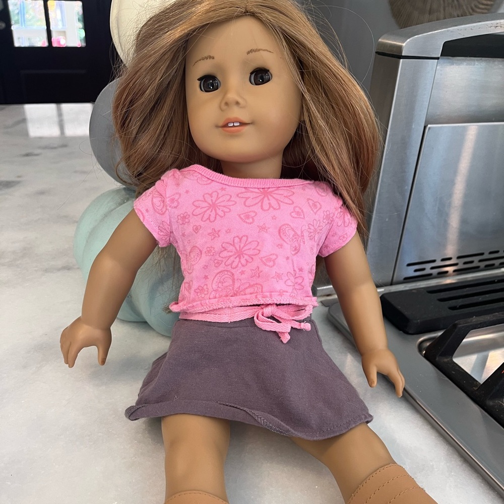 American Girl Doll with Pink Top and Gray Skirt